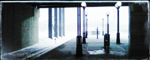 Secaucus Station, New Jersey - a dark underpass with lamps receding toward the light, before a snow storm