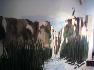 The mural with the reeds painted in along the base of the wall