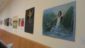 A gallery wall hung with the framed parasha paintings at the Barkai exhibition - photo