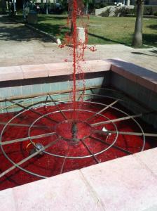 Red colored water in the Safra Square fountain