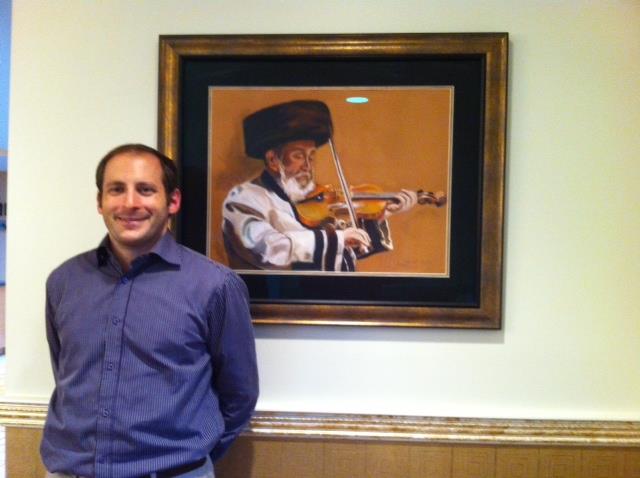 Nachliel Selavan beside the framed Kretshnif portrait